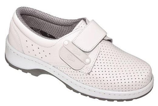Scarpa in pelle di vacchetta con fodera traspirante e doppia chiusura intercambiabile tra velcro e lacci nello stesso modello di scarpa. Ultimo dritto con punta arrotondata. Colore bianco