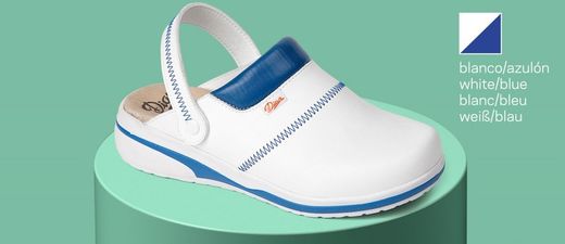 Zoccolo con cinturino di supporto del tallone pieghevole, realizzato in microfibra tecnica traspirante con imbottitura sul collo del piede per evitare irritazioni. Colore bianco / blu